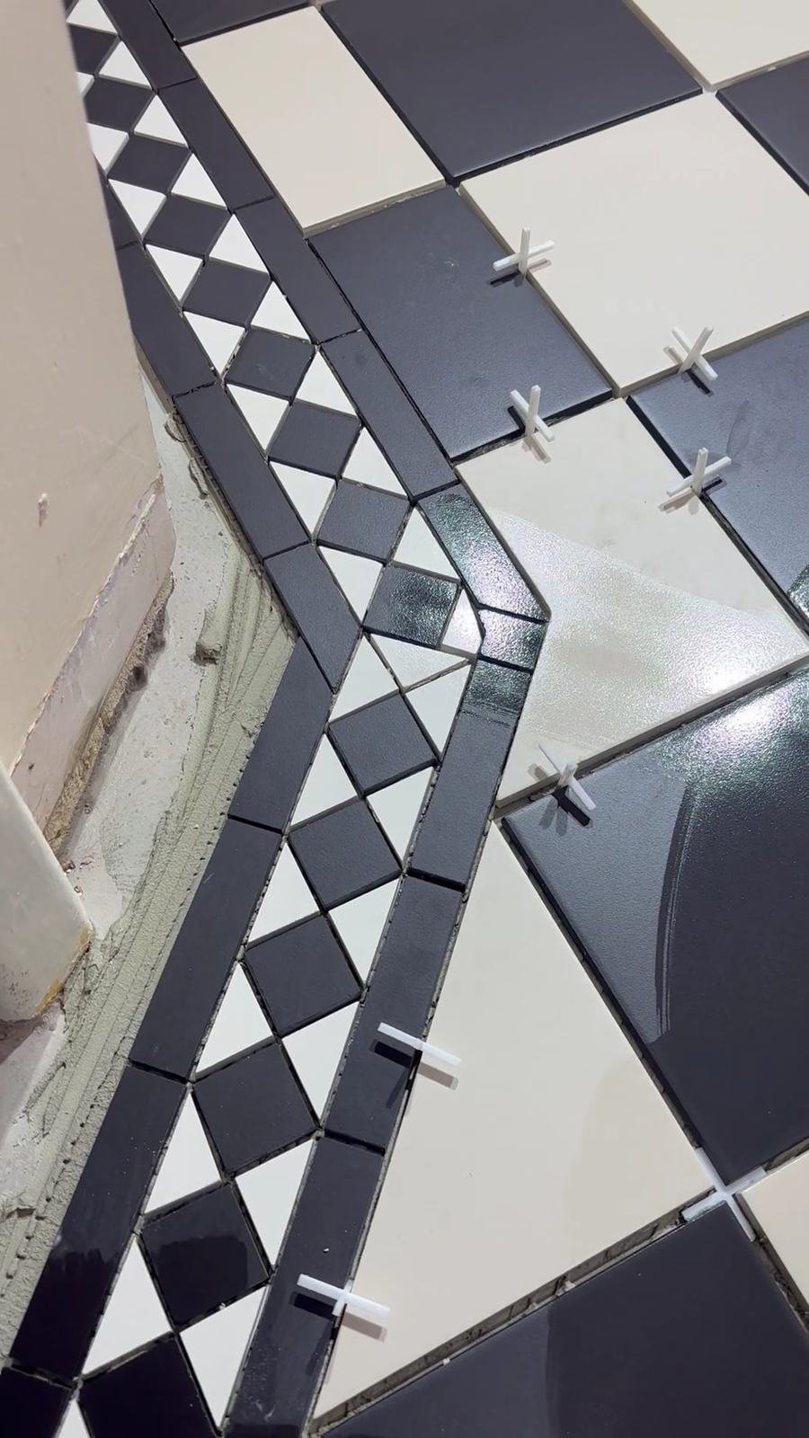 Victorian border tiles being set out with spacers